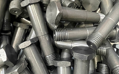 A Close Up Of A Disorganized Pile Of Steel Bolts And Nuts