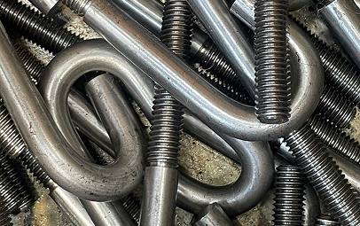 A Close Up Of A Pile Of Assorted Metal Screws And Nuts